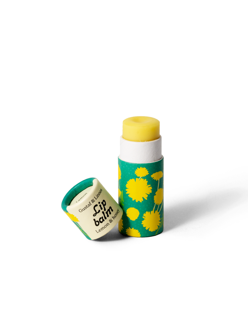 Lip balm lemon and honey, opened package with dandelion pattern