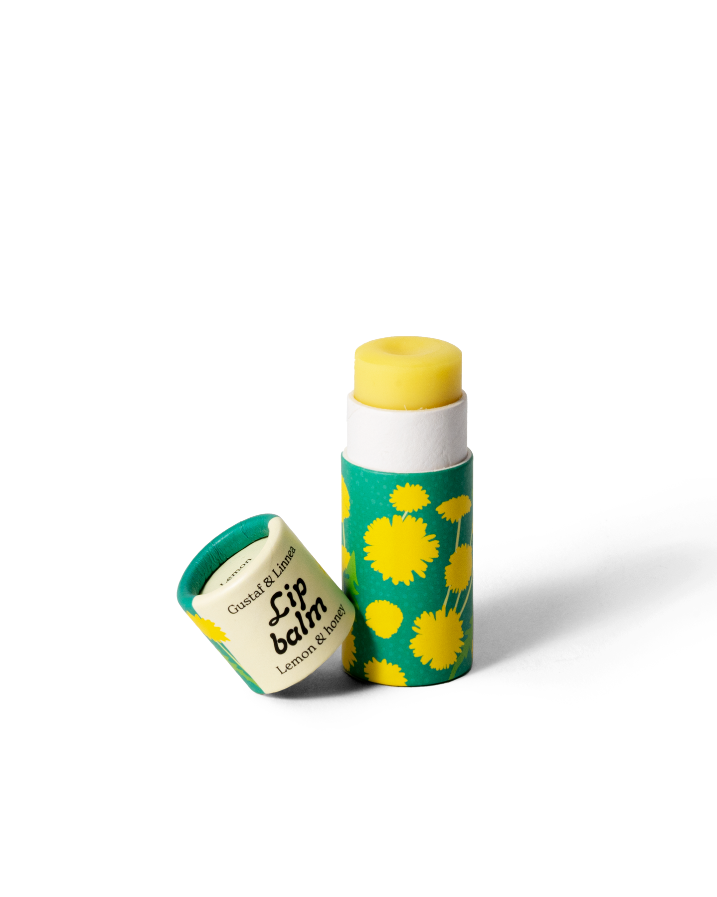 Läppcerat med citron och honung, öppnad förpackning med maskrosmönster