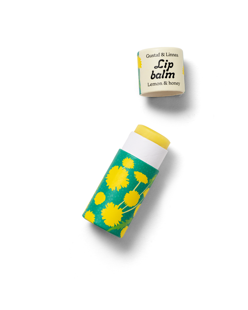 Lip balm lemon and honey, opened package with dandelion pattern