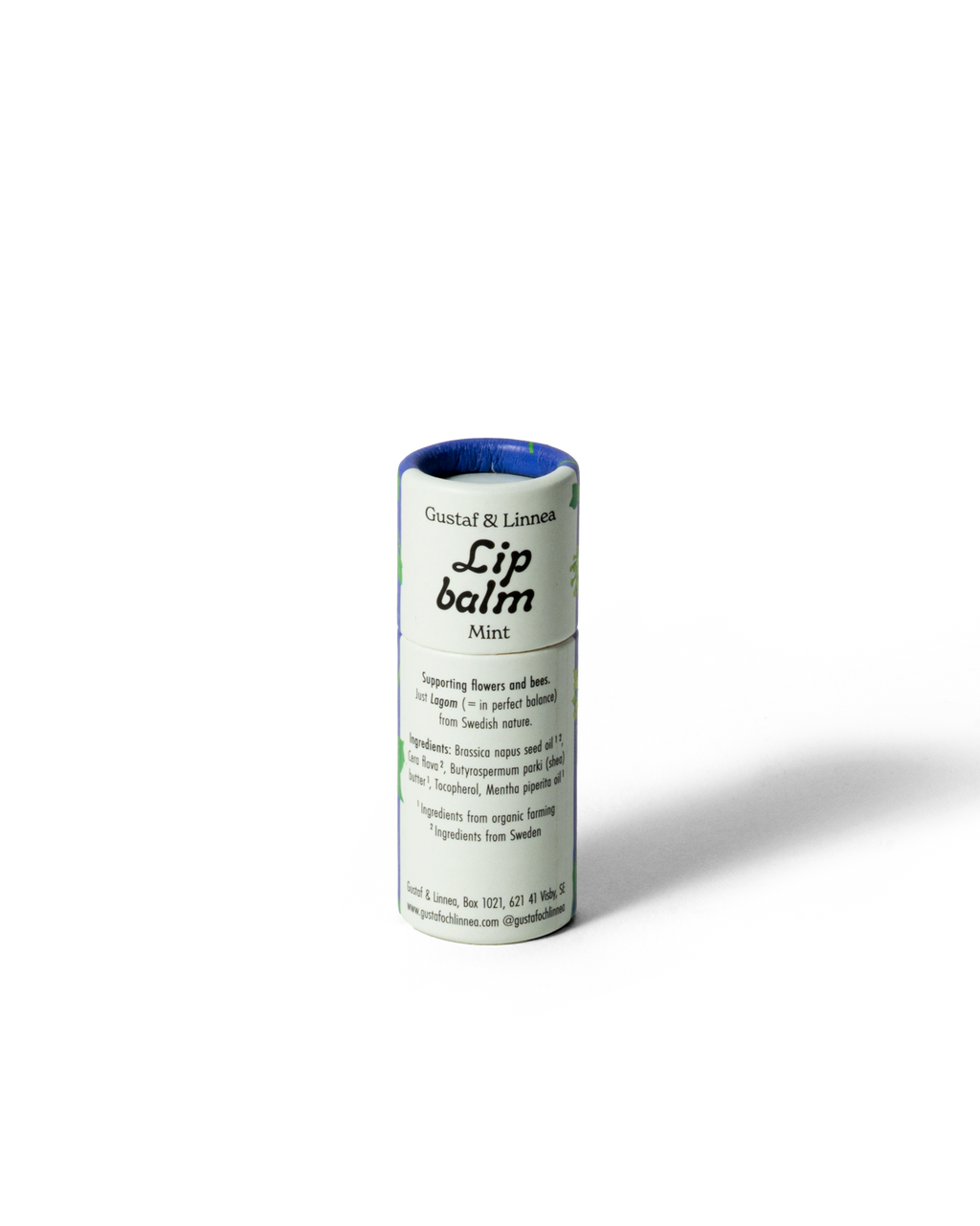 Detaljbild av läppcerat med murgröna och naturliga ingredienser.