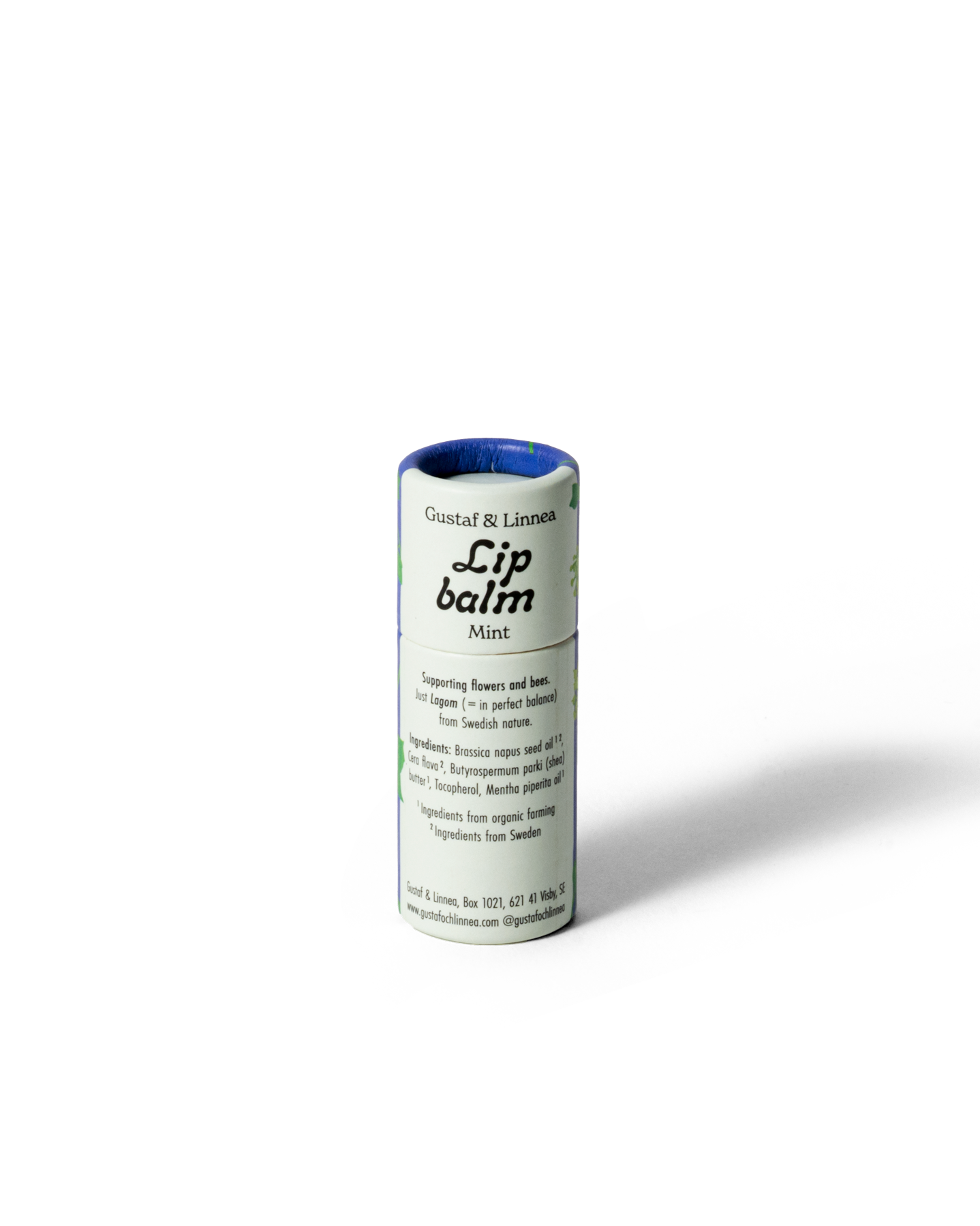 Detaljbild av läppcerat med murgröna och naturliga ingredienser.