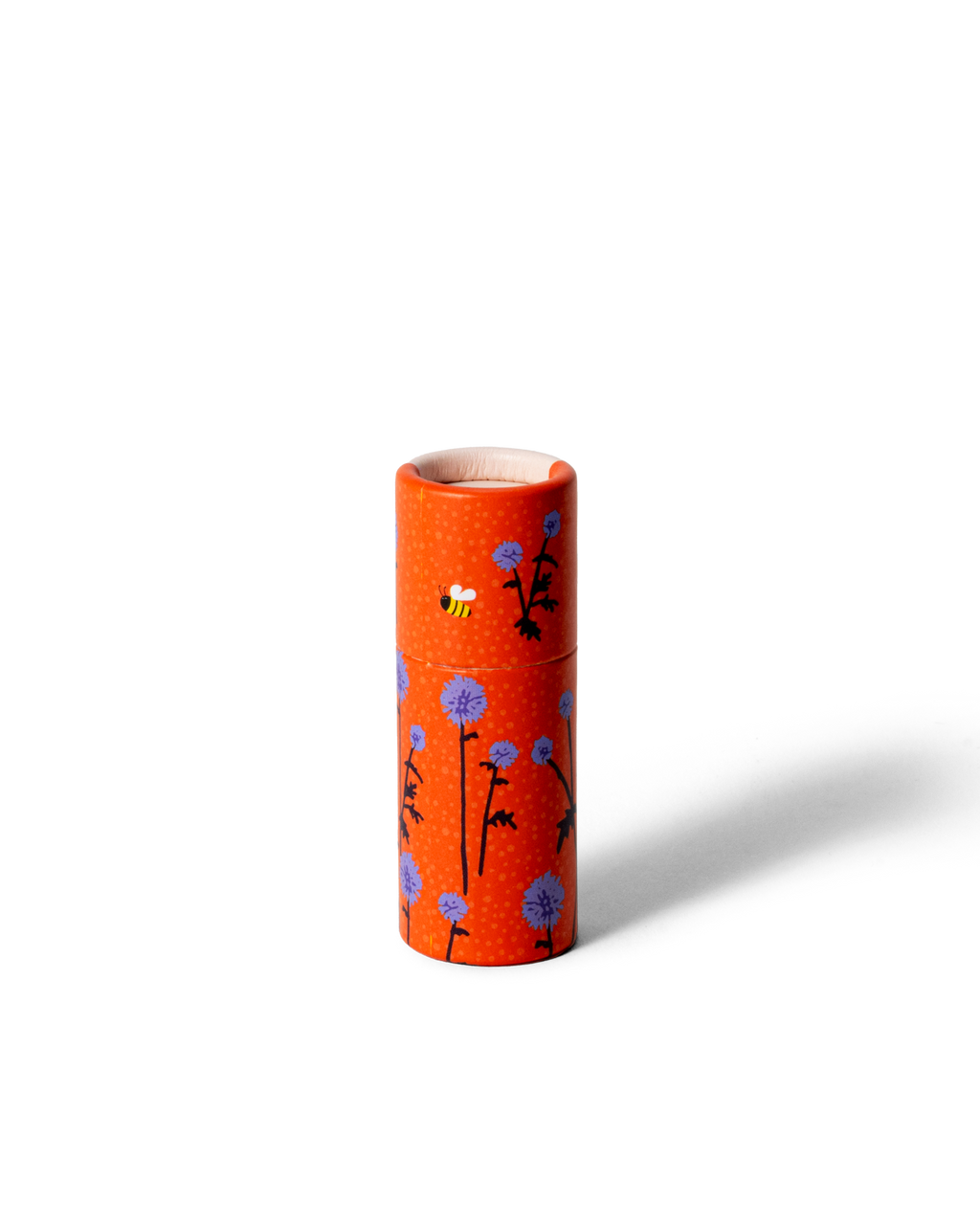 Handmade lip balm Gustaf & Linnea with orange sleeve and thistle motif.